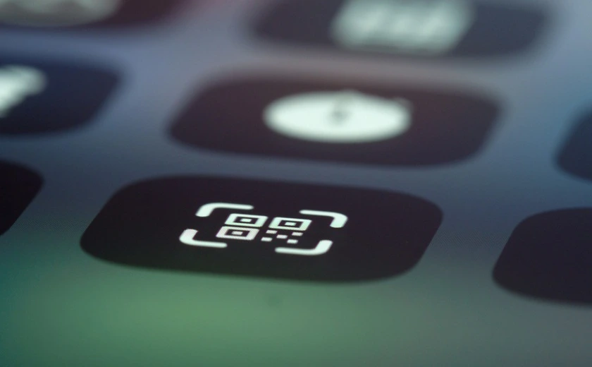 Close-up of a QR code scanner app icon on a phone screen